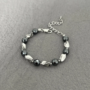 Minimalist hematite beaded bracelet with twisted metal spacers and lobster clasp