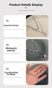 Detailed view of double-layer star necklace with irregular light blue stone and cubic zirconia