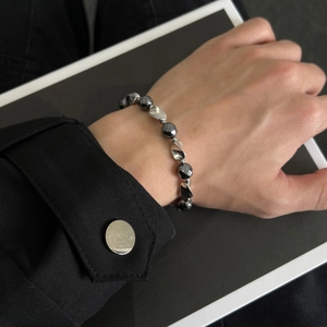 Modern minimalist hematite beaded bracelet with faceted grey stones and silver accents