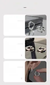 Détails des créoles Mobius argentées avec gravure Lucky et design torsadé