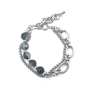 Double-layer stainless steel bracelet featuring silver links and natural cracked stone beads