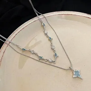 Double-layered silver titanium steel necklace featuring a blue zircon star pendant