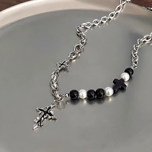 Cross pendant necklace with black white beads and silver chain in punk style