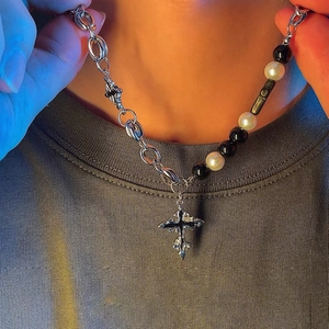 Asymmetric cross necklace with black beads and white pearls for unisex streetwear style