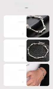 Detailed view of silver bone-link chain bracelet with smooth electroplated finish