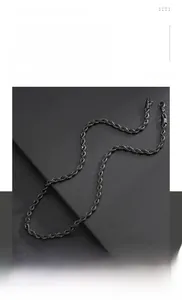 Macro shot of black titanium steel twisted rope chain necklace with hip hop texture