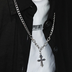 Gothic silver cross necklace with embossed relief pattern on a chunky curb chain