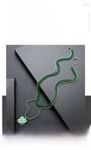Detail of double-layer titanium steel necklace with green checkerboard square pendant