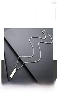 Close-up of a minimalist titanium steel rectangular bar pendant necklace for men and women