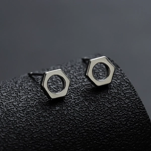 Industrial hex nut stud earrings in polished silver stainless steel for a minimalist look