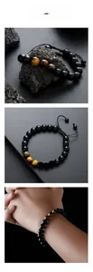 Detail of adjustable tiger eye and black obsidian beaded bracelet with woven cord