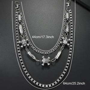 Detail of multi-layered silver punk wallet chain with skulls and bullet charms, 44cm to 64cm