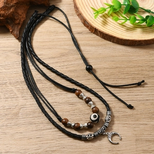 Ethnic bohemian layered necklace with wooden beads and silver crescent moon pendant