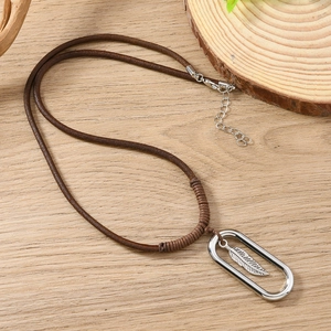 Retro braided leather necklace featuring a silver feather pendant in an oval frame