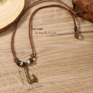 Vintage Viking axe pendant necklace with etched patterns on a brown leather cord