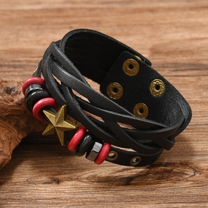 Close-up of vintage braided leather bracelet with bronze star charm and metal snaps
