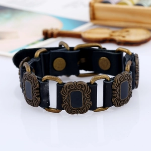 Retro punk wide black leather bracelet with embossed bronze alloy plates and snap closure