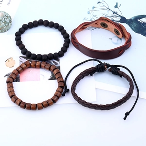 Set of 4 vintage leather bracelets featuring braided rope, wooden beads, and black stone beads