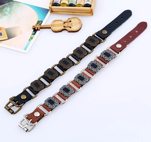 Men's punk leather bracelet in black and reddish brown with vintage metallic accents