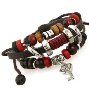 Detailed view of multilayer leather bracelet with vintage key charm and wooden beads
