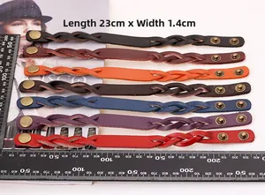 Bracelets en cuir tressé en sept couleurs avec boutons-pression bronze, 23cm