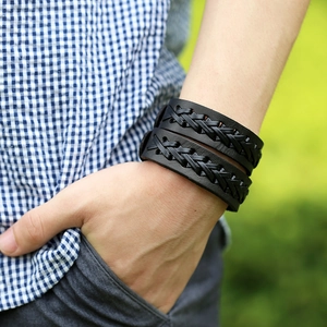 Men's double-layer black braided leather bracelet featuring a rustic punk design on a wrist