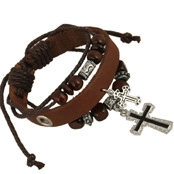 Detail of multi-layer vintage brown leather bracelet with wooden beads and cross pendants