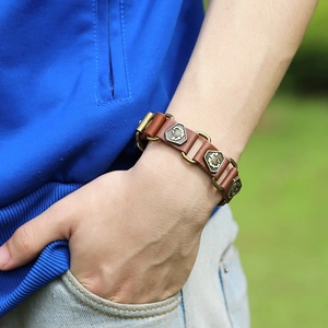 Vintage brown leather men's cuff bracelet with bronze metallic embossed details