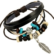 Detailed shot of multilayer leather bracelet with feather charm and vintage beads