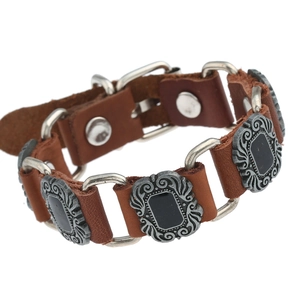 Brown cowhide leather bracelet in punk style with embossed metal plates and silver buckle