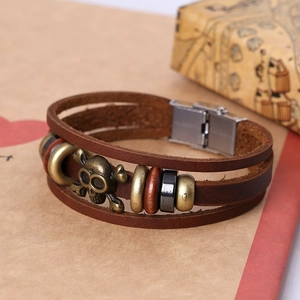 Retro multi-layer brown leather bracelet with bronze skull and metal clasp closure