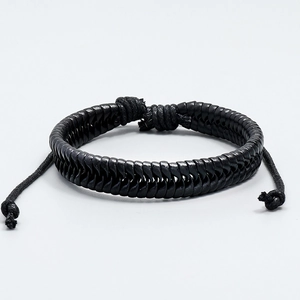 Close-up of black braided leather texture and adjustable drawstring knot closure
