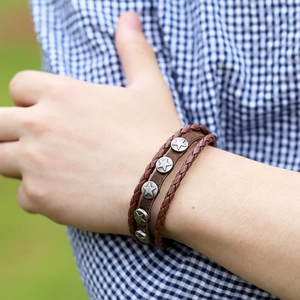 Vintage layered brown leather bracelet with woven cords and metallic star studs for men and women
