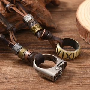 Vintage leather cord necklace with adjustable Roman numeral gold and silver ring pendants