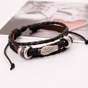Punk multilayer beaded leather bracelet with a silver wing charm and braided ropes