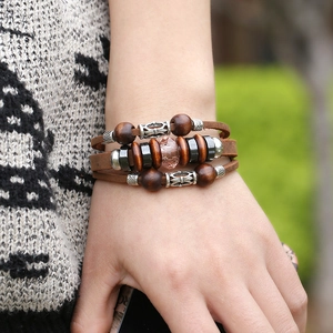 Vintage woven multilayer leather bracelet with wooden beads and engraved metal accents