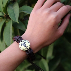 Luminous Taurus zodiac leather bracelet with vintage metal clasp on a wrist