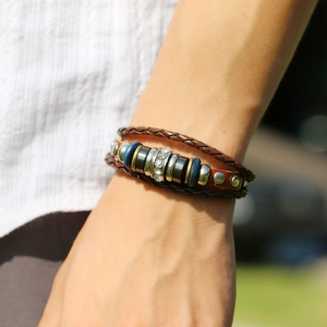 Retro multi-layer woven leather bracelet for couples with metal beads on a male wrist