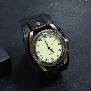 Close-up of vintage punk leather watch with bronze alloy case and Roman numeral dial