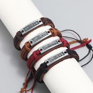 Retro multi-layer woven leather bracelet set featuring a metal plate with believe engraving