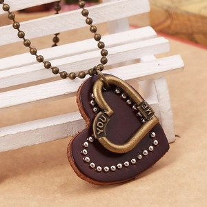 Vintage heart leather pendant necklace with bronze bead chain and engraved metal detail