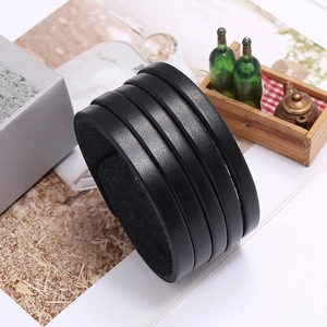 Punk style wide black leather bracelet with four parallel bands and lychee texture