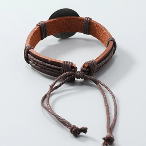 Detail of hand-woven leather bracelet with adjustable drawstring knot for men