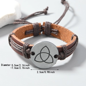 Retro brown leather bracelet featuring a silver Celtic knot charm with adjustable cord
