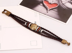 Detail view of multilayer leather bracelet with bronze star emblem and mixed beads