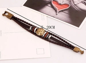 Detail of vintage multilayer leather bracelet with star metal charms and 20cm length tag