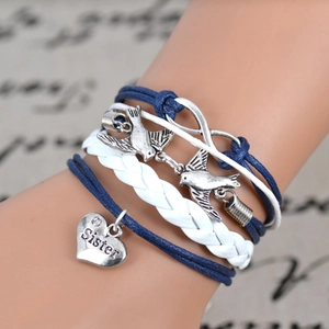 Bohemian multilayer friendship bracelet with silver love bird and sister heart charms