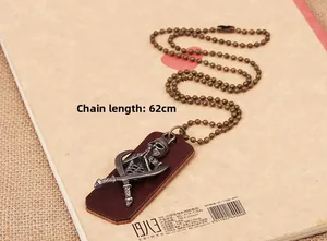 Detail of skull pendant with crossed swords on leather base and a 62cm bead chain