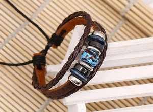 Detail of multi-layer braided leather bracelet with marble beads and adjustable wax cord