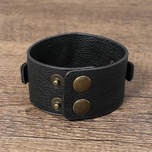 Minimalist punk black PU leather bracelet with textured surface and bronze snap buttons